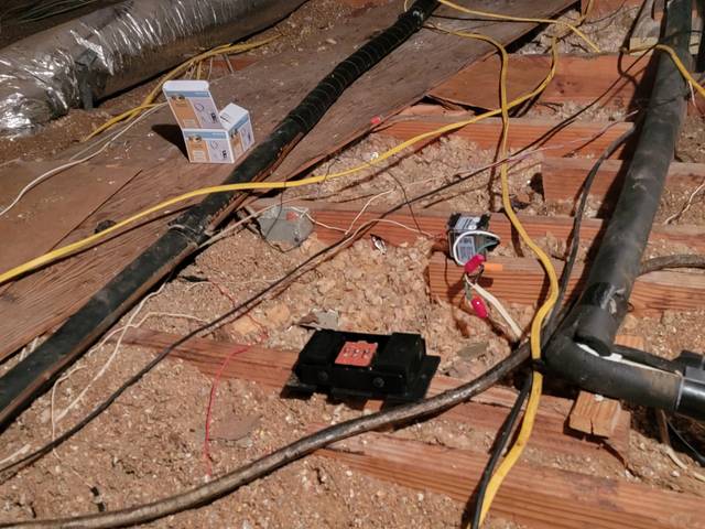 New cable run through the rafters of an attic